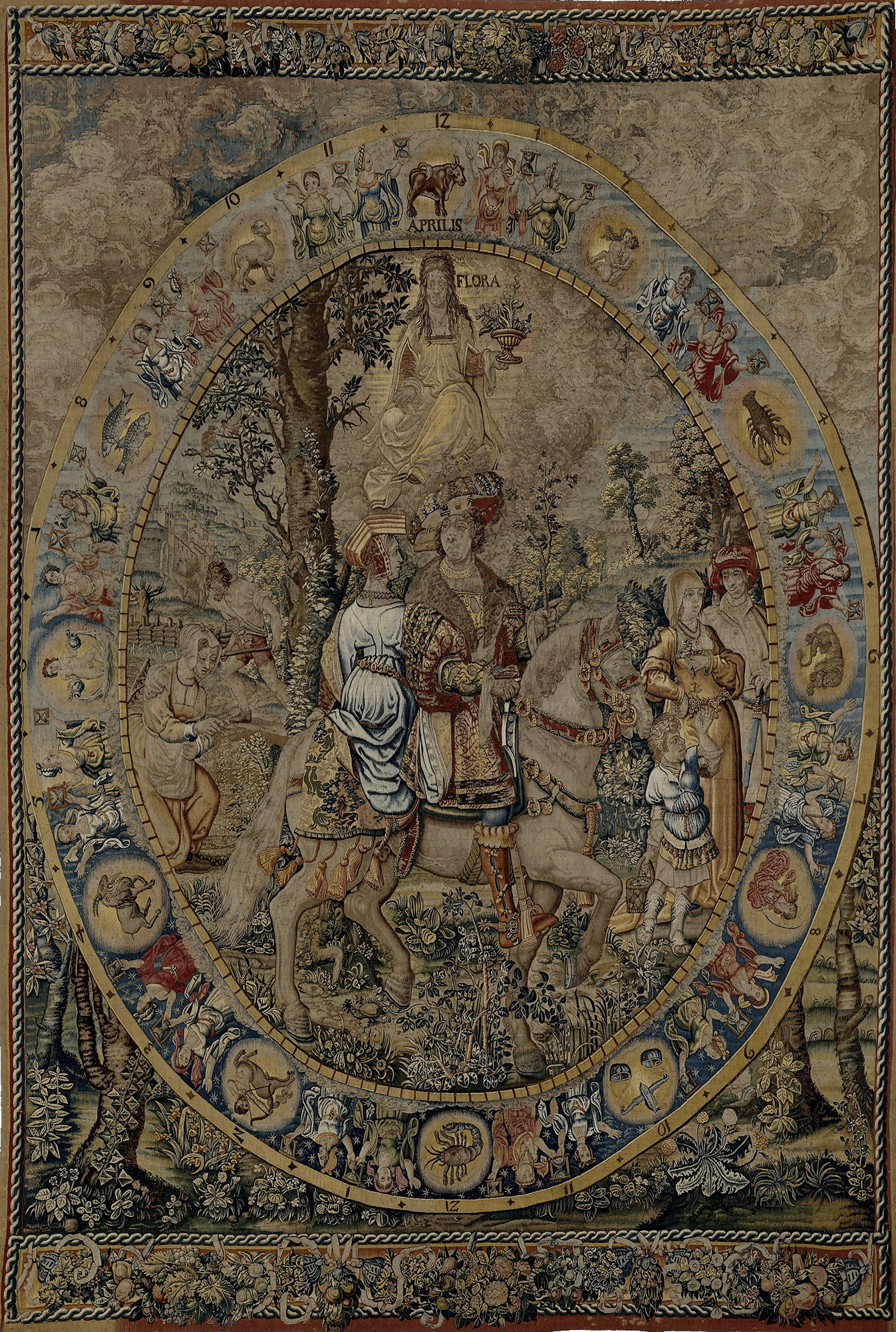 A tapestry depicting a scene with a central figure on horseback, surrounded by a procession and a backdrop of a zodiac ring, set against a floral border.