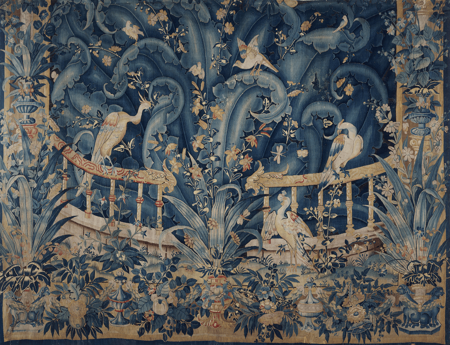 Serene Large Leaf Aviary: A Detailed Reproduction of a Late 17th Century Flemish Verdure Tapestry Featuring Exotic Birds Amidst Flourishing Flora with Elaborate Floral Border RE466493