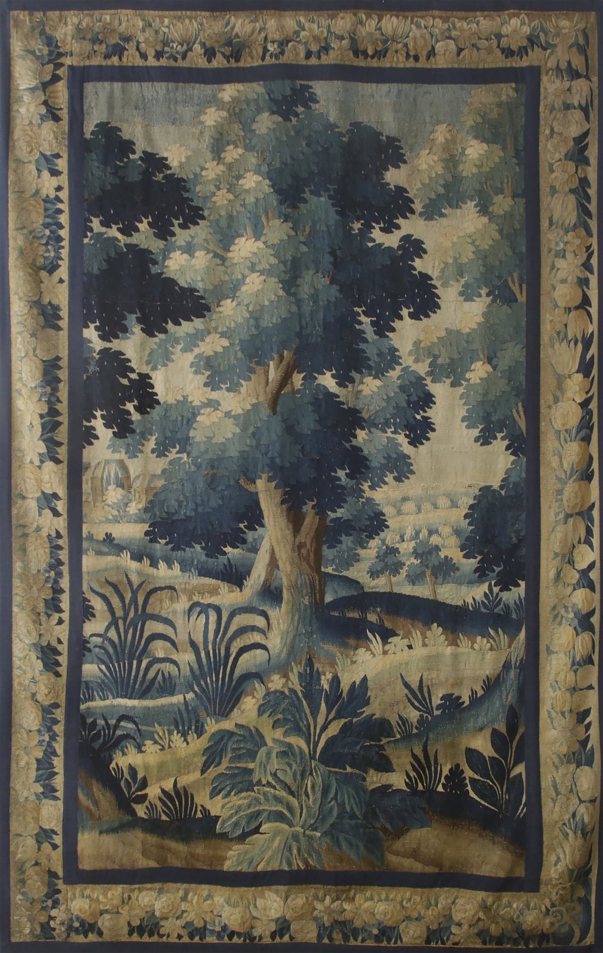 Decorative rug with a landscape design featuring trees and foliage.