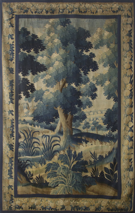 Decorative rug with a landscape design featuring trees and foliage.