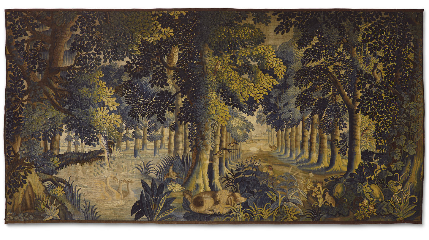 Tapestry depicting a forest scene with trees and animals